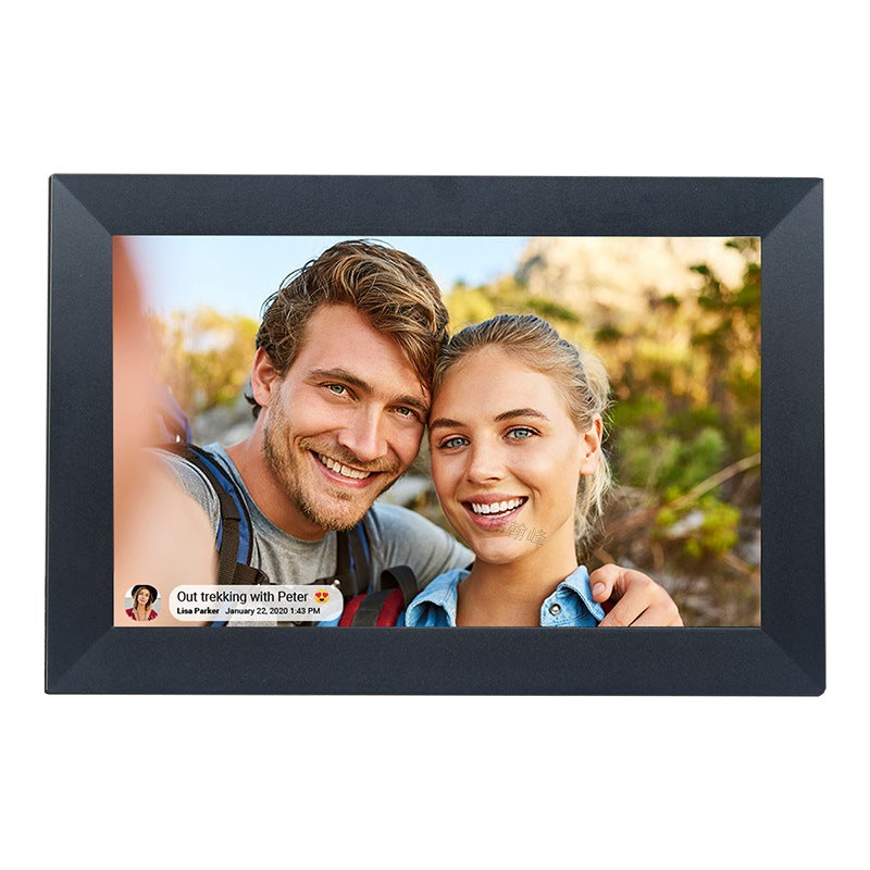 Digital photo frame displaying a couple outdoors with a scenic background