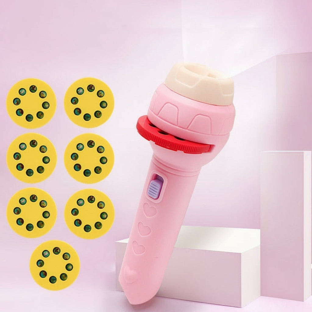 Pink toy flashlight projector with yellow projection wheels on a pink background