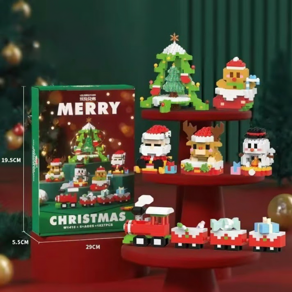 Christmas-themed building block set with packaging on a green background